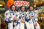 Soyuz TMA-02M crew in front of the capsule.jpg
