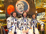 Soyuz TMA-21 crew in front of the capsule.jpg