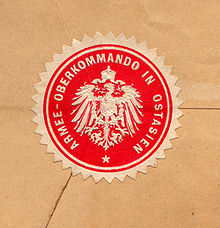 Foto des Siegels auf einem Briefumschlag, rund mit Zacken